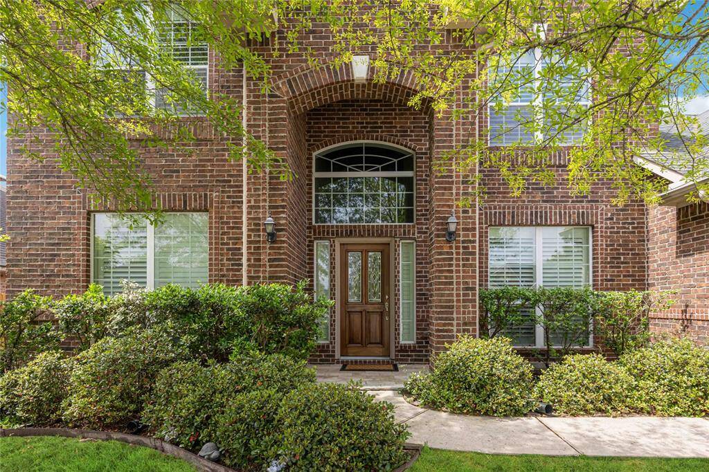 Enjoy the lush landscaping easily maintained with the built-in sprinkler system.