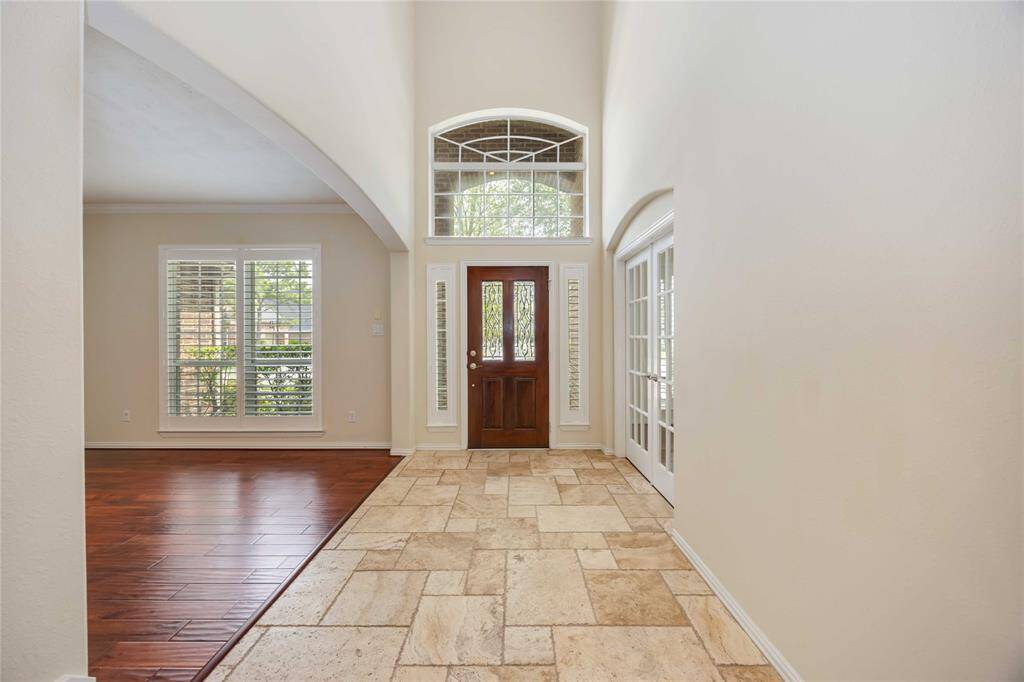 A grand entry under a soaring ceiling welcomes your guests!