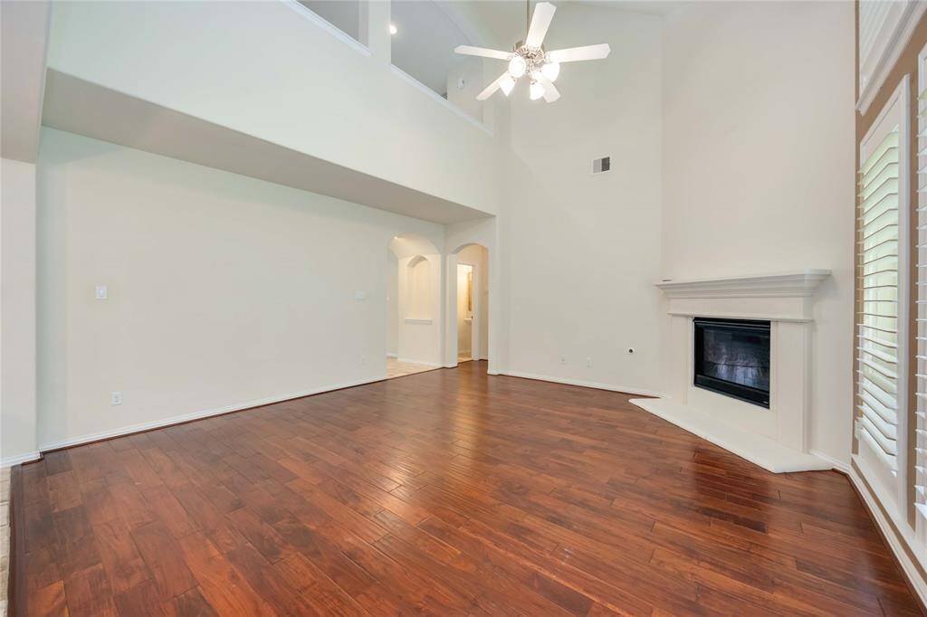 Beautiful engineered wood floors run seamlessly throughout most of the home.