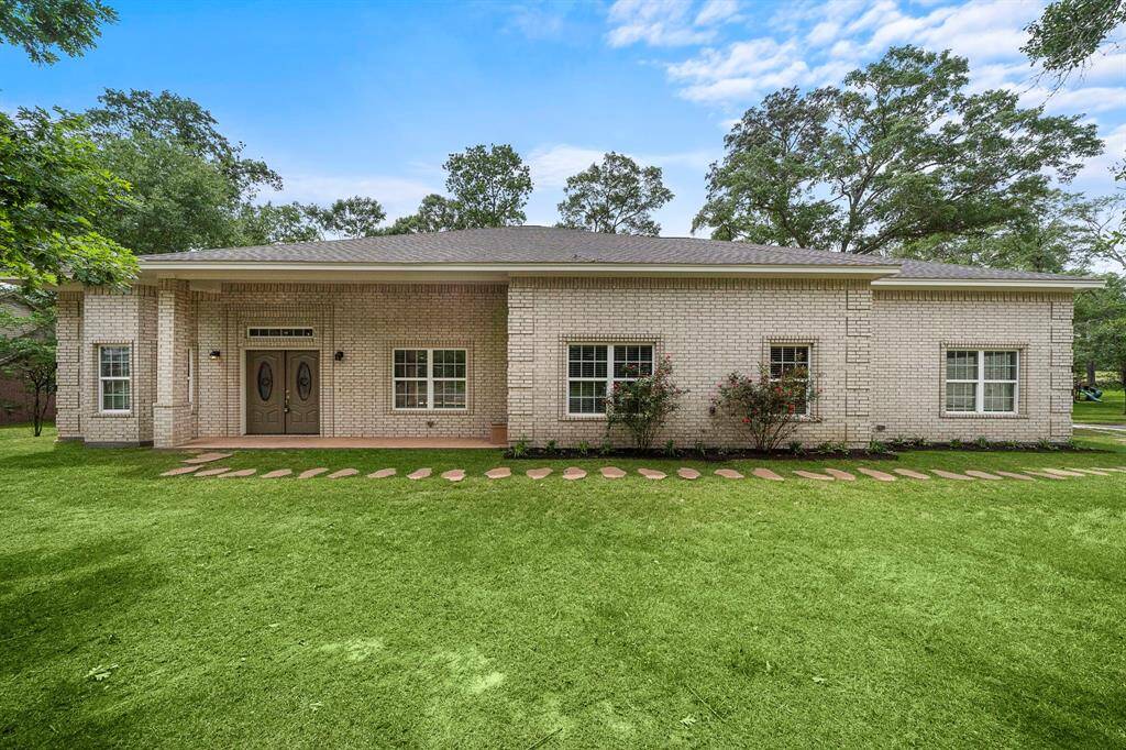 Charming home at 26 Panorama Drive, boasting a classic brick exterior and a well-manicured lawn, perfectly situated on the scenic Panorama Golf Course. This inviting residence features a double front door with decorative glass, spacious windows with shutters, and a cozy front pathway lined with stepping stones. Nestled in a serene, tree-lined setting, this property offers timeless appeal and a peaceful retreat, ideal for golf enthusiasts and nature lovers alike