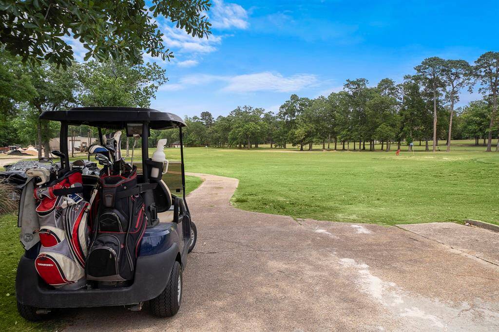 Enjoy morning rounds from your doorstep, with a 4-car garage to store your golf cart and gear, and a covered patio for relaxing post-game. Beyond golf, the home is just minutes from Lake Conroe, ideal for boating and fishing adventures. Panorama Village amenities include scenic walking trails and a vibrant community clubhouse, ensuring a fulfilling lifestyle.