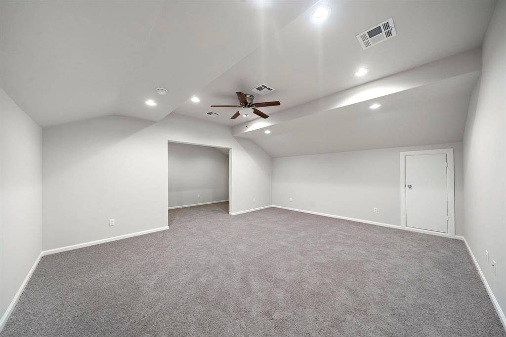 Welcome to the ultimate flex space! Freshly updated with brand new carpet and paint, this expansive upstairs room is a blank canvas ready to suit your lifestyle. Whether you envision it as a vibrant game room, a cozy media space, an oversized 4th bedroom, or the home office of your dreams—this room can do it all.Recessed lighting, neutral tones, and a ceiling fan create a comfortable and inviting atmosphere, while the additional nook offers even more space for a reading corner, play area, or exercise space