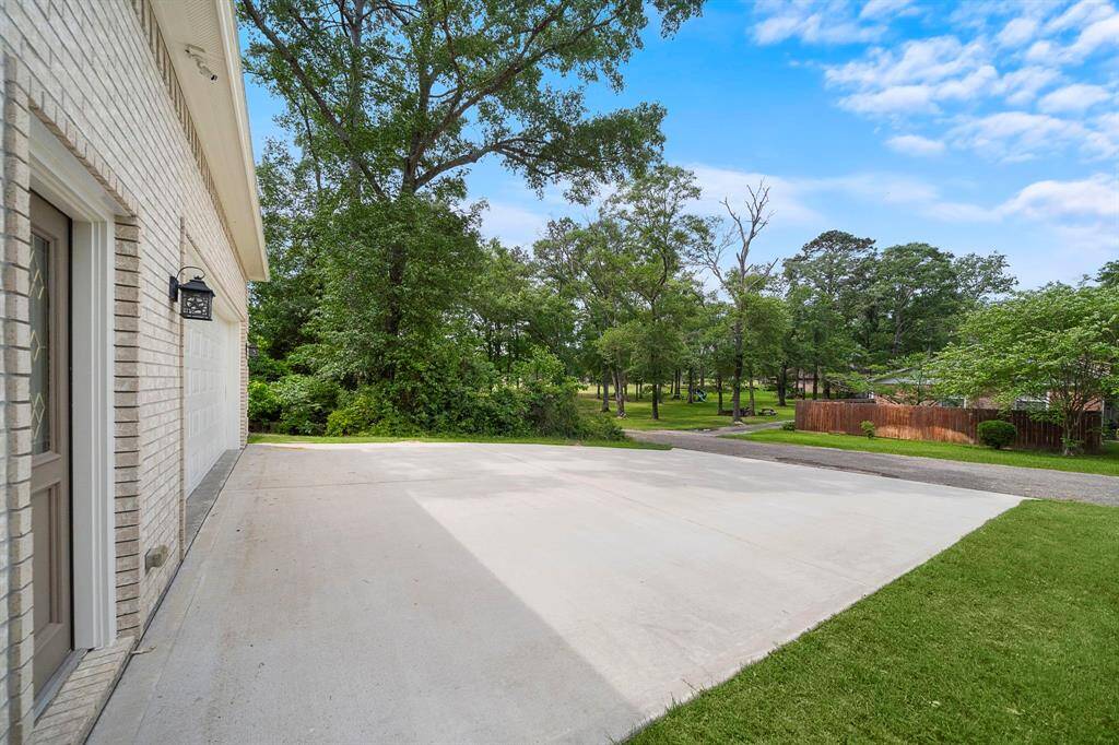 Speaking of convenience, the wide concrete drive leads directly to a 4-car garage—and best of all, it backs up to the golf course, allowing you to hop on your cart and be teeing off in minutes.