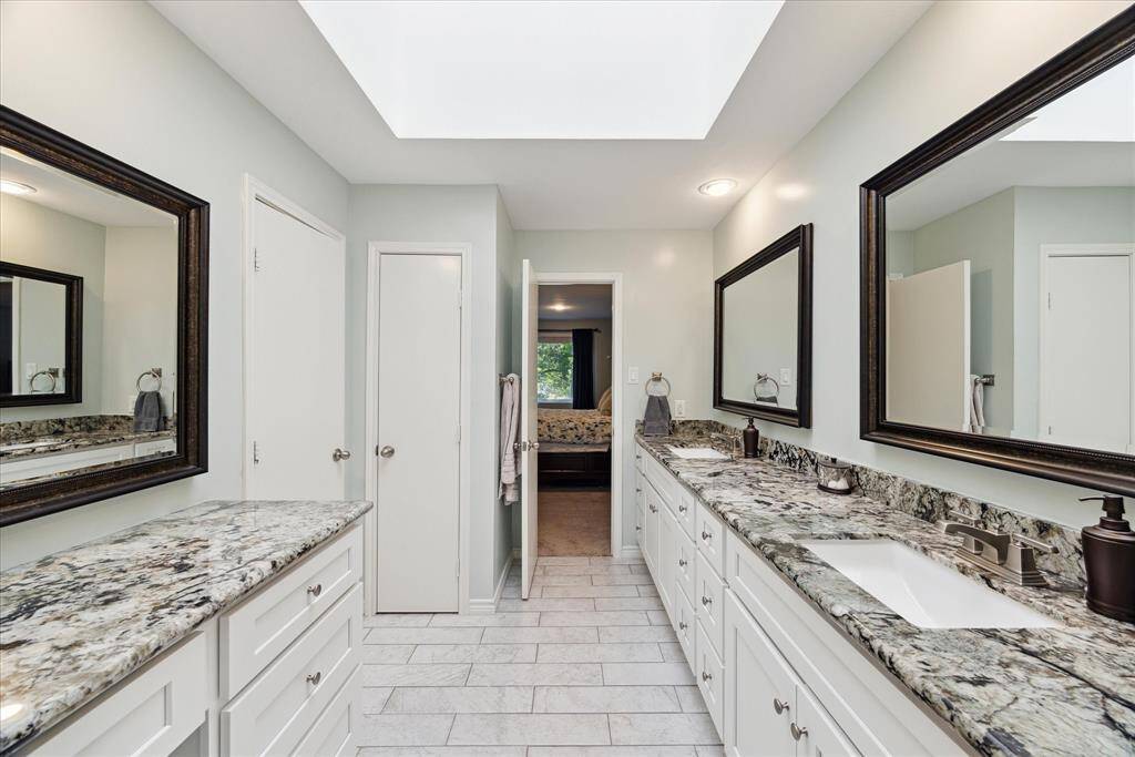 Experience the luxury of a spacious en-suite bathroom, complete with a private water closet and a separate shower area. A generous walk-in closet awaits just beyond, offering ample storage space for a serene and organized retreat.