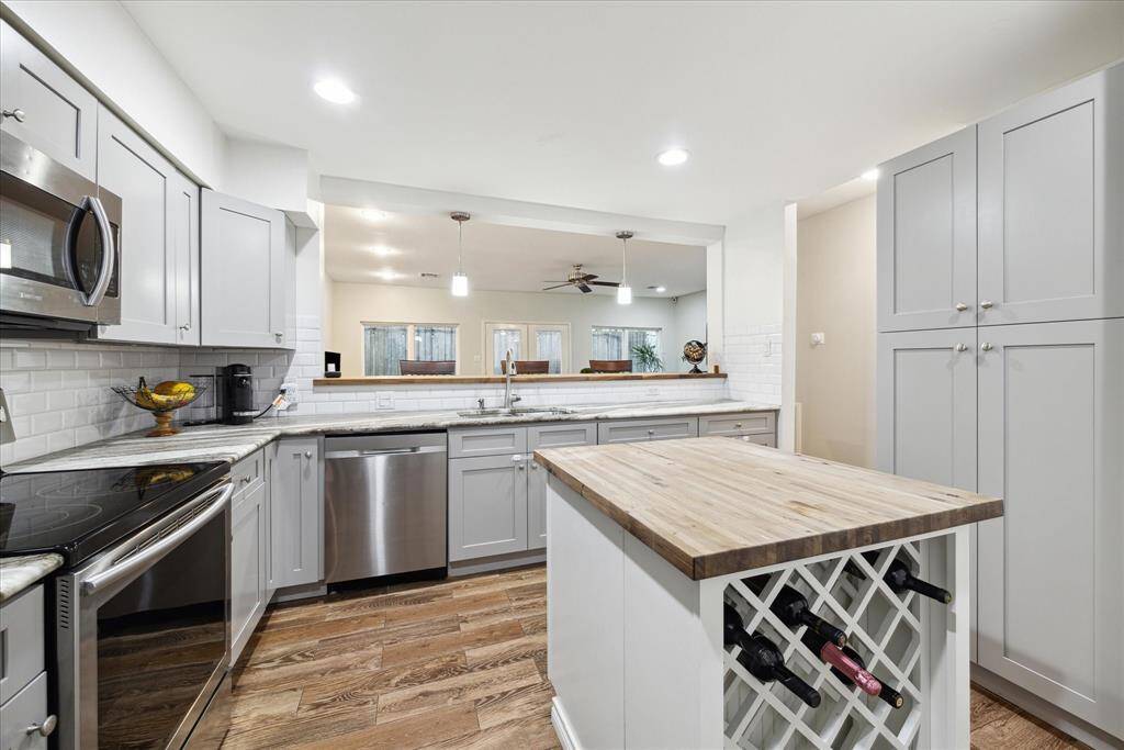 Enjoy enhanced privacy with the secure, gated entrance of this charming townhome.