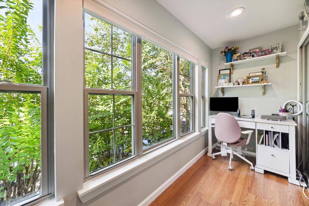 Experience tranquility in this serene office space, thoughtfully converted from a balcony to offer you inspiring tree-lined views. A perfect haven for productivity and peace.