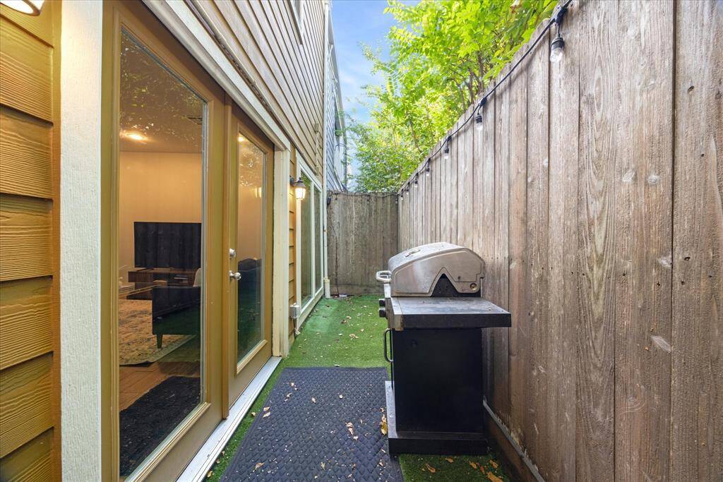 Enjoy intimate outdoor dining on this newly turfed patio, perfectly sized for a small grill and bistro set.