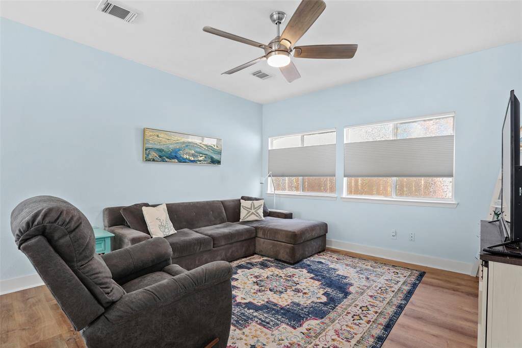 The living room is large and opens up to the kitchen.