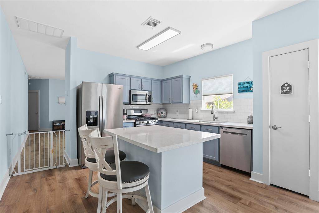 The kitchen has stainless steal appliances and beautiful quartz countertops.