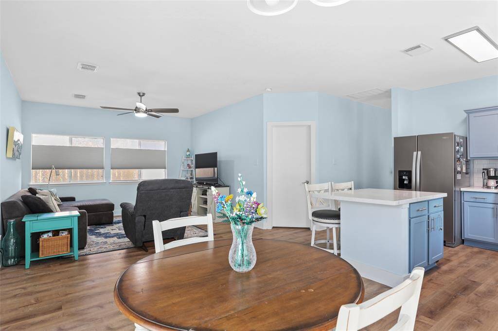 Open concept kitchen, living and breakfast area.