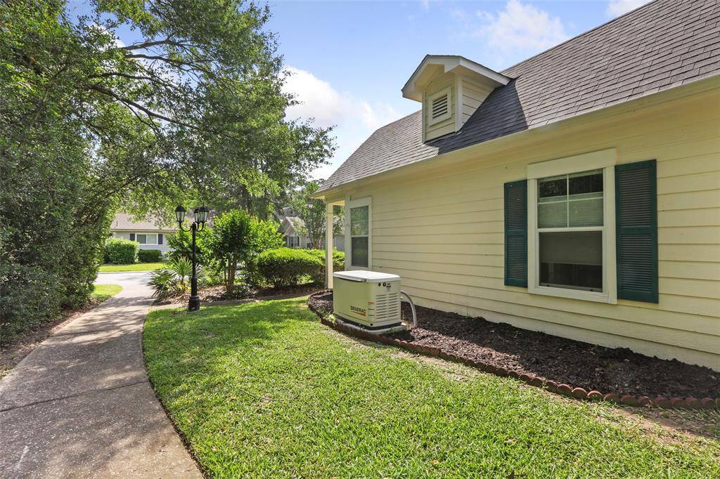 The Generac generator is located on the side of the home.