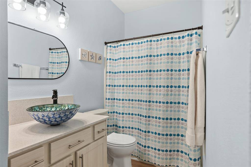 Updated bathroom with bowl sink and new faucet ant toilet.