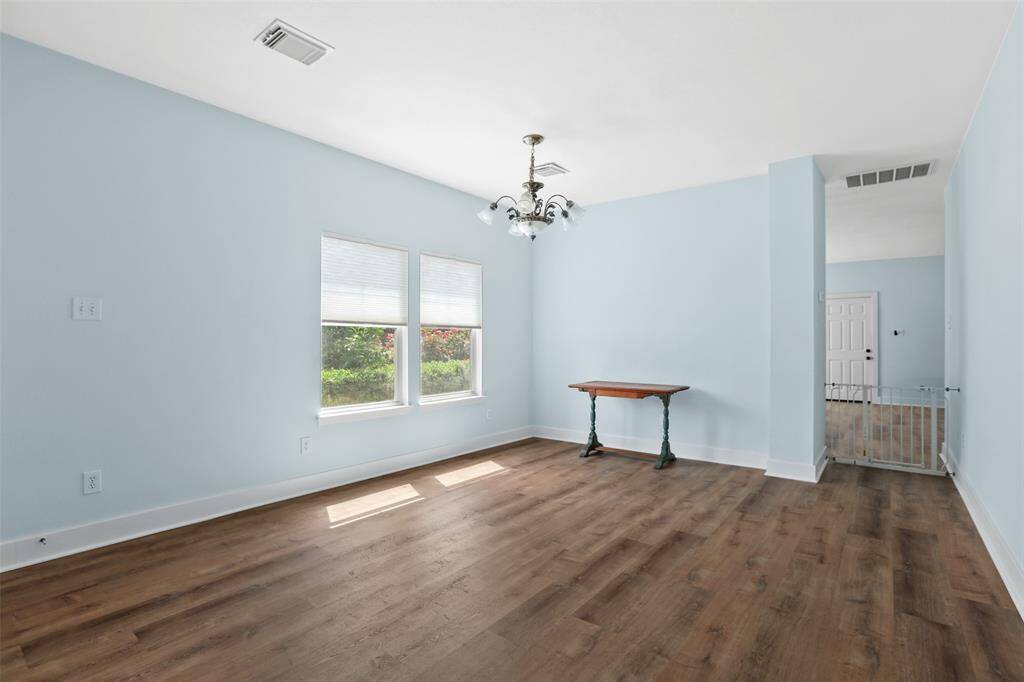 Large living space that can be used as dining room or another living area or even a game room.