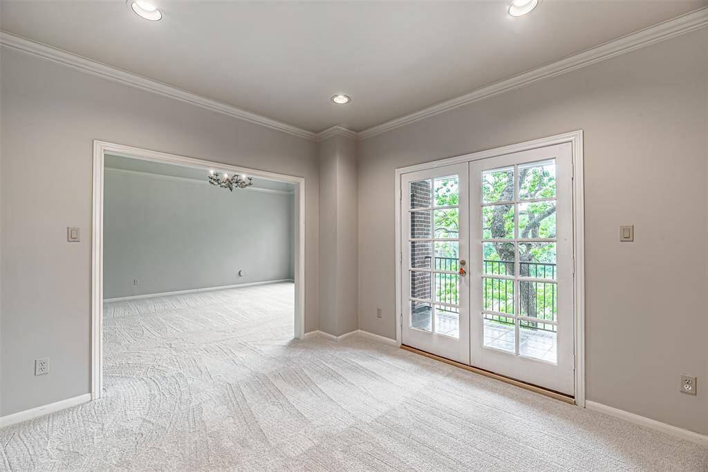 This room is off the primary bedroom and would make a great nursery, study or exercise room. Also opens out to a great view of the backyard.