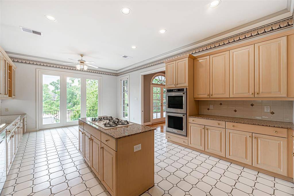 Cooking is a breeze with double ovens and granite counter tops for prepping.