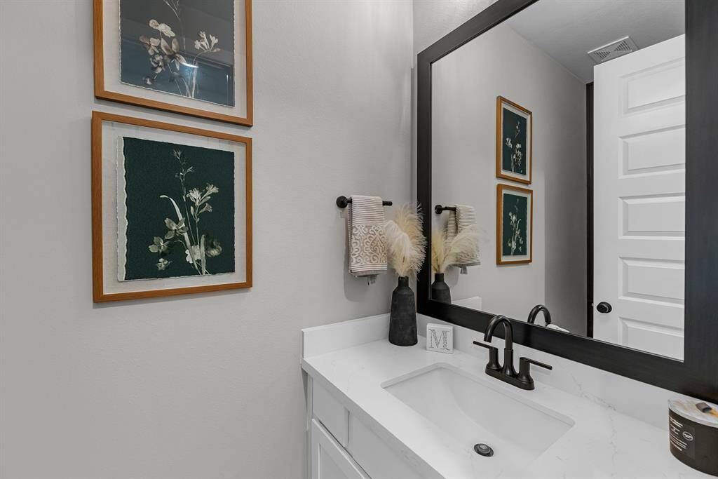View of the powder bathroom, located downstairs. Perfect for your guests.