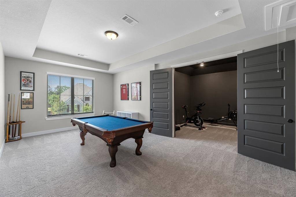 Versatile upstairs game room showing entrance to the media room.