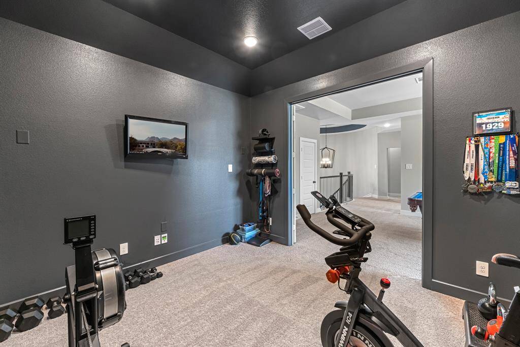 The media room is perfect for entertaining or for your home gym!