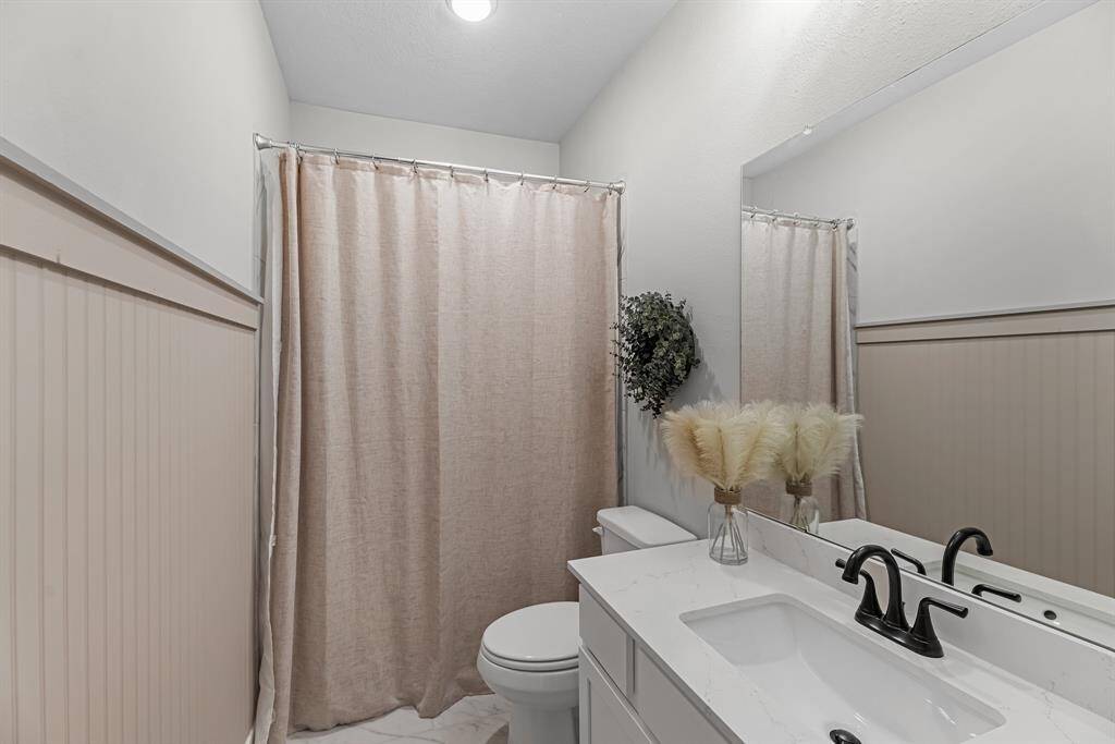 Full bathroom #3 located upstairs outside of bedroom #4!