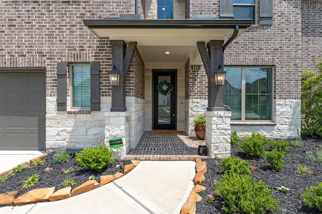 Welcoming front elevation with a charming covered porch.
