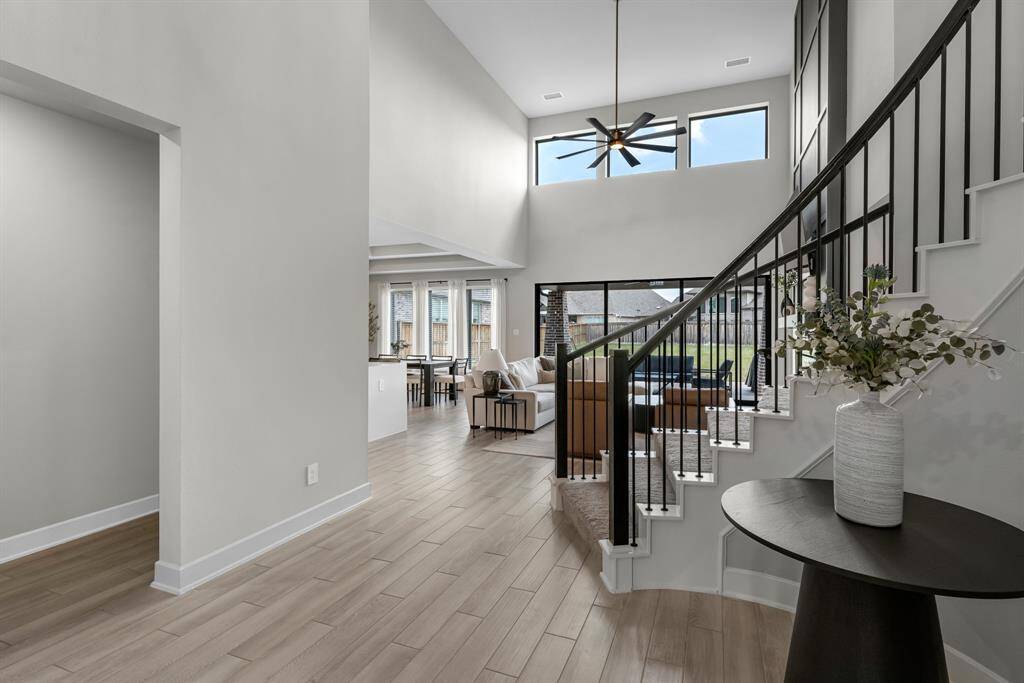 Inviting entryway featuring soaring ceilings and abundant natural light.