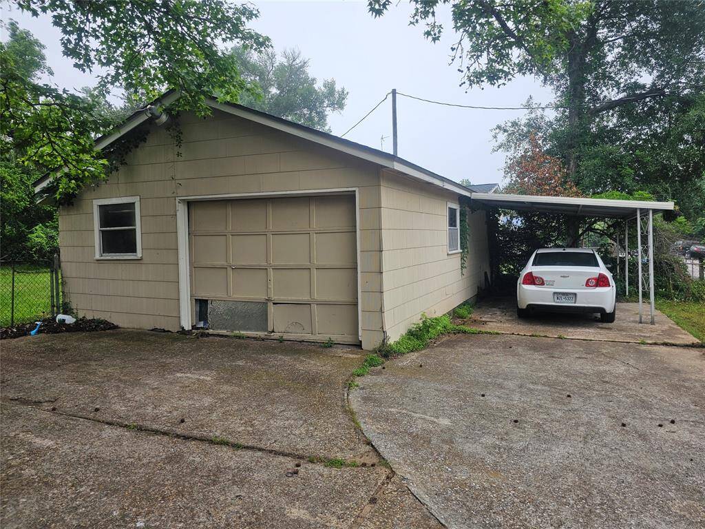 Detached garage with carport