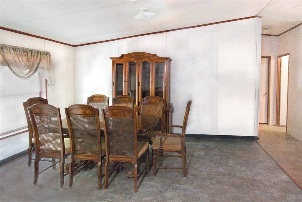 Embrace country charm in this cozy 10' x 15' Dining Area! Separate from the kitchen, it’s perfect for hearty meals and warm gatherings. Add your own rustic oak table under a farmhouse chandelier sets the scene for family suppers or quiet coffee mornings.