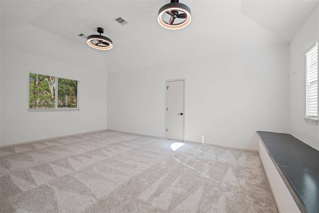 Upstairs game room with window bench