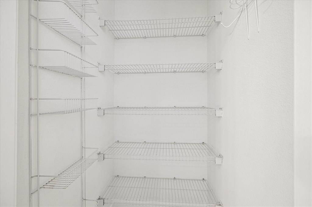 Additional storage located in the bathroom for linens.
