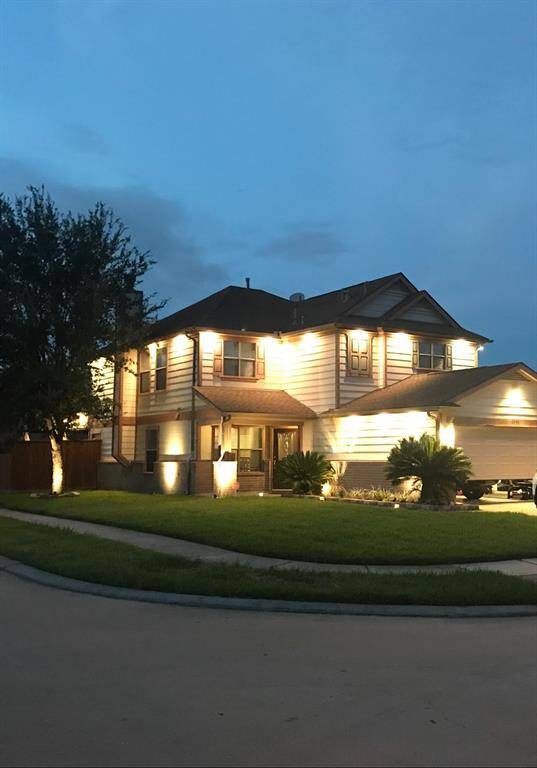 Custom exterior lighting elevates this home.