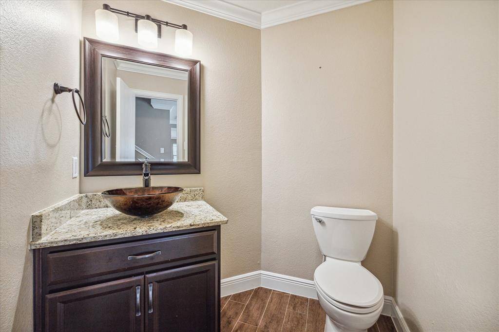 A conveniently located powder bath sits on the first floor.