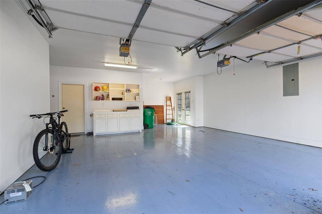 Oversized garage has room for the golf cart, too.
