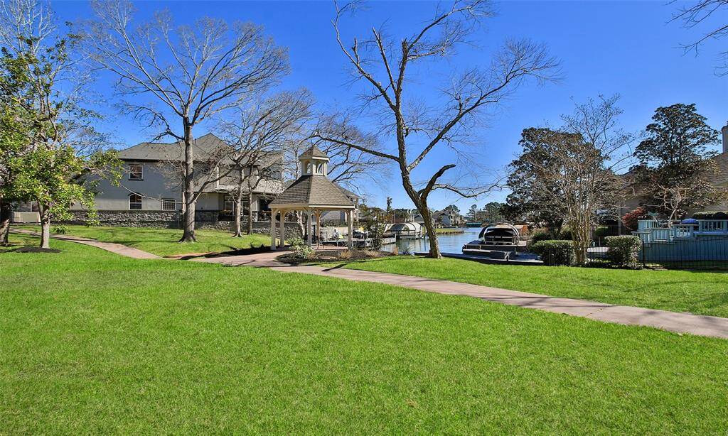 From the back patio, you'll enjoy waterviews like this every day. Walking trail is conveniently located behind the property.