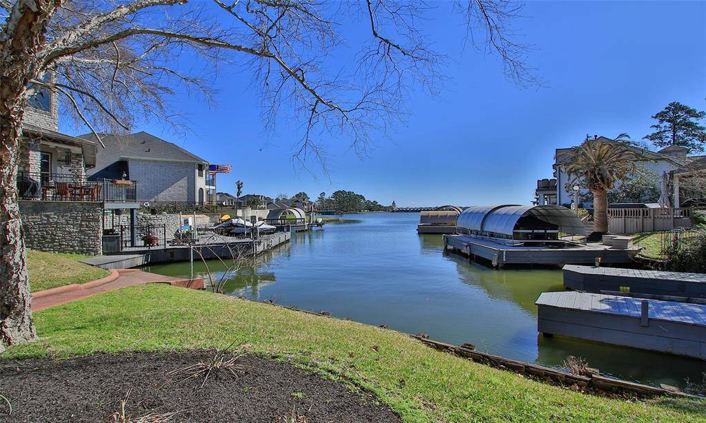 Perfect for unwinding, the serene lake backdrop adds a beautiful touch to this inviting outdoor space.