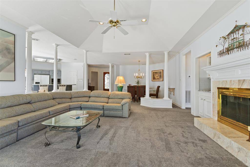 Living room with vaulted ceiling is open to kitchen and dining. Guests will enjoy the open spaces with stunning views from every perspective.