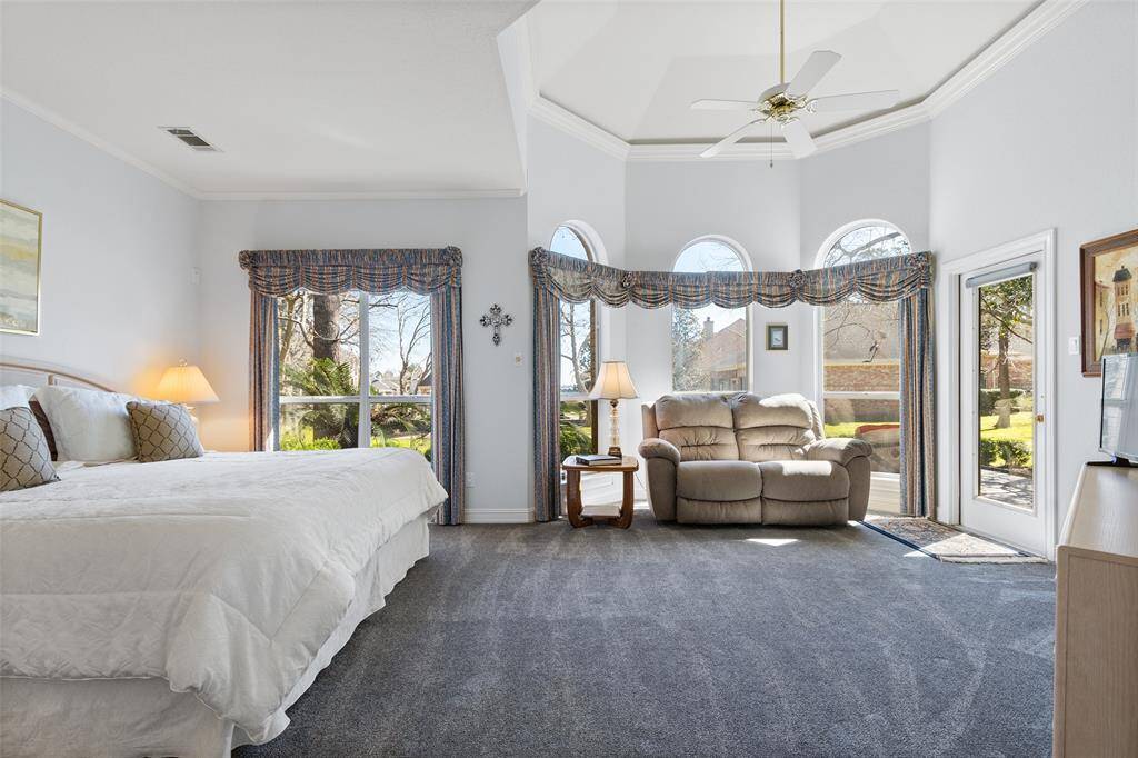 Enormous primary overlooks the lush lawn and Lake Conroe water views near the gazebo. These views will never change, as the land behind this property is designated as a park area for Somerset residents only.