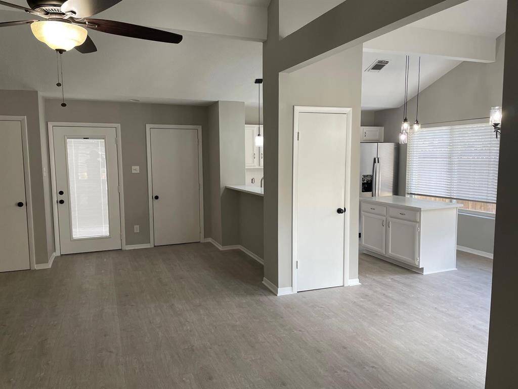 Front Door walks into open living room, kitchen and breakfast area.