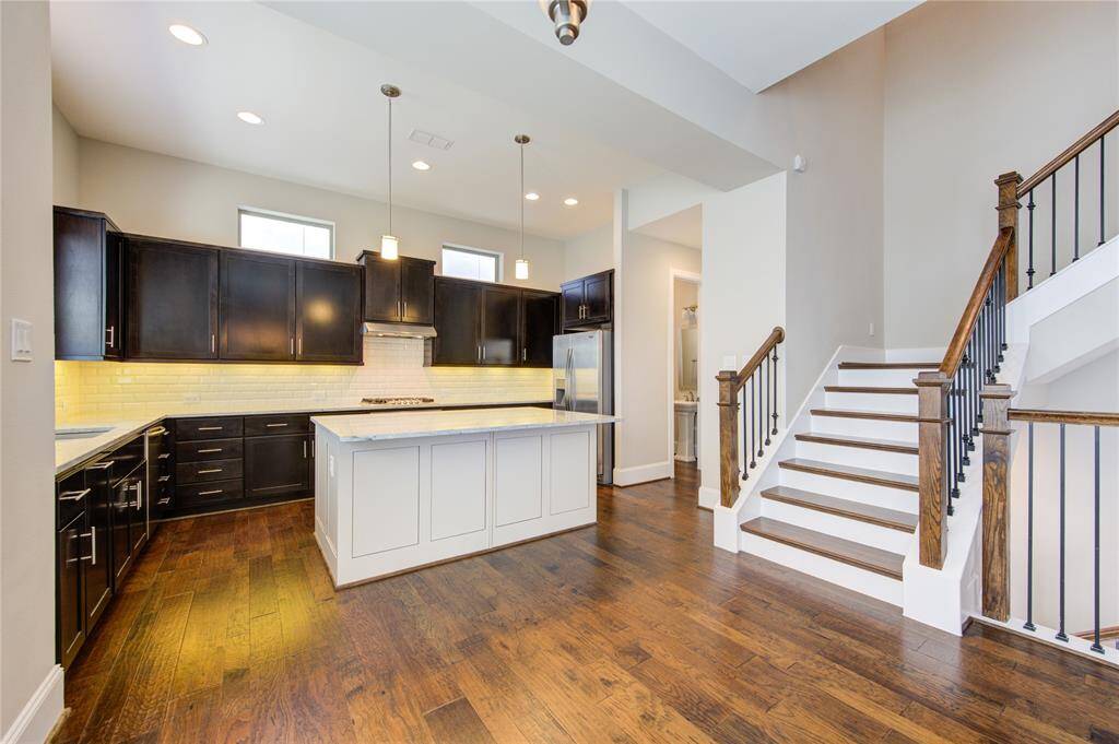 This dining area is large enough for a formal table to complement the breakfast bar.