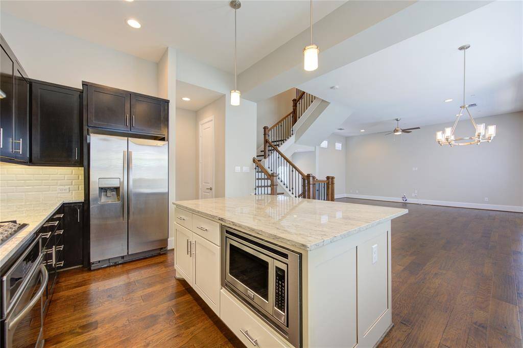 The subway tile backsplash and overhead vent add both style and functionality.  There is also a CuZn UC-200 water filter installed under the sink.