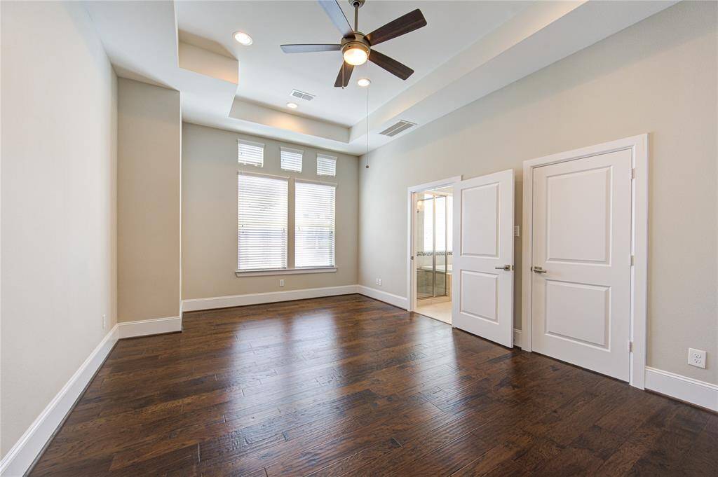 The 8" baseboards and the ceiling fan complete this beautiful room.
