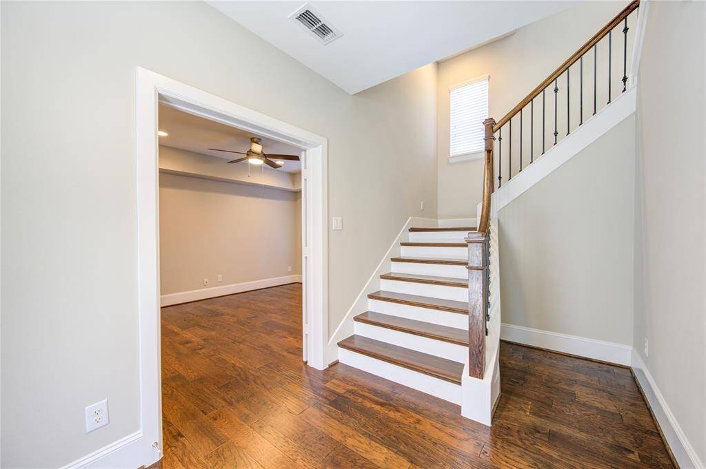The hickory hardwood entry welcomes guests.  The double doors lead to the downstairs BR just off the entry.