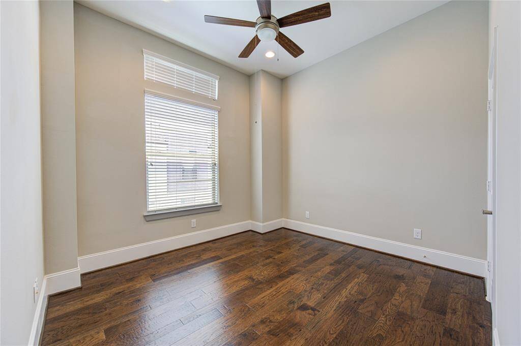 The utility room boasts upper cabinets and a shelf and rail.   The washer and gas dryer can convey with the sale.