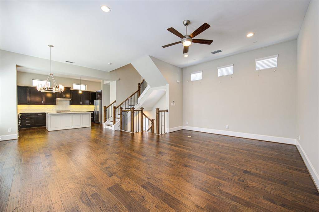 The family room features a ceiling fan, recessed can lighting, floor outlet and switch controlled wall outlets.
