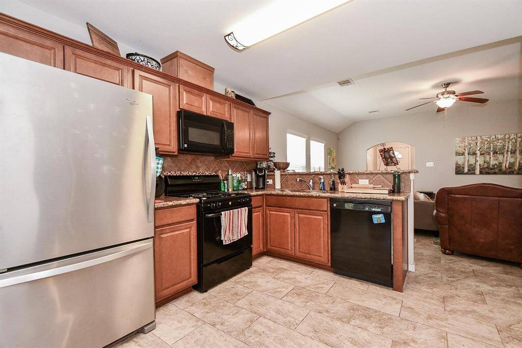 Showcase your culinary talents in this kitchen, equipped with all the essentials.