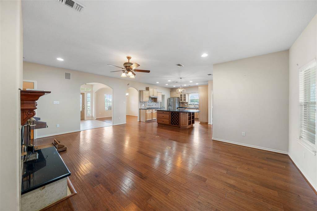 The open-concept layout shines here, connecting the living room and kitchen with uninterrupted sightlines and excellent space for entertaining or everyday living.
