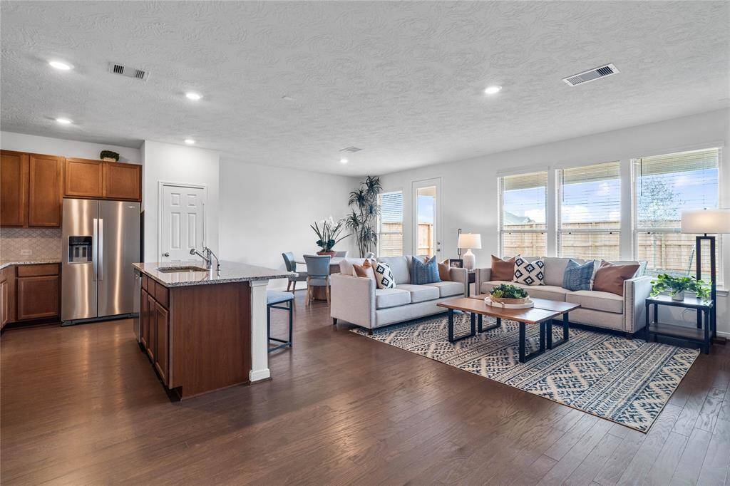 Additional view of the open concept living, dining and kitchen areas.