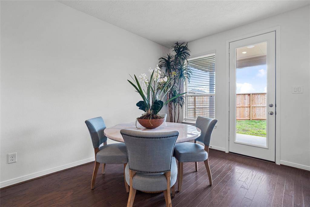 Start your day off right with a cup of coffee sitting with your family in the lovely breakfast area! Featuring large windows with blinds, custom neutral paint, tile flooring, recessed lighting and high ceilings!