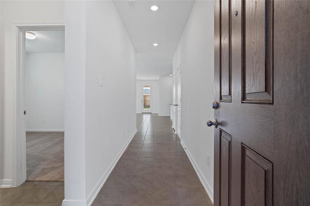 Welcome to your new home at 3531 Sage Green. You are greeted with this beautiful entryway featuring tile flooring, neutral paint, and recessed lighting.