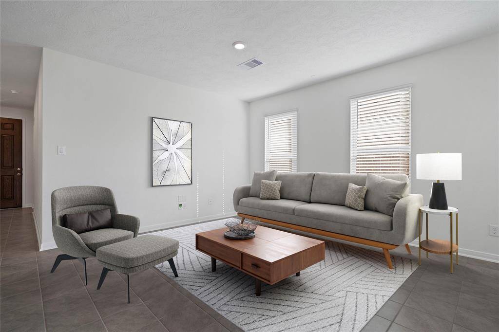 This light and bright spacious great room is the perfect layout for entertaining or just relaxing. Whether it's simply a night in or entertaining family and friends, this home has ample open space for everyone to enjoy! Featuring tile flooring, large windows with blinds, high ceilings, recessed lighting with wonderful access to your gorgeous kitchen.
