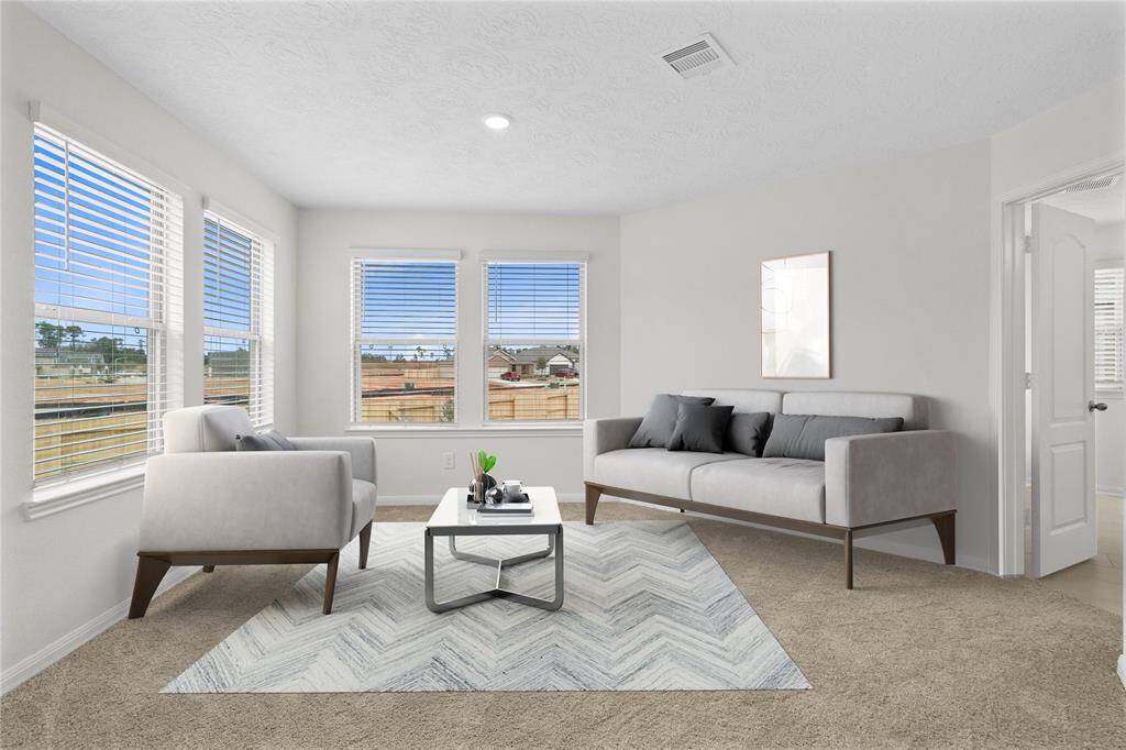This sitting room joined with the primary bedroom is perfect for sitting with a book, an office, workout room, or even a nursery. The possibilities are endless and makes the primary suite an oasis of privacy.
